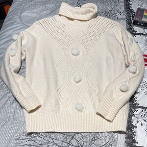 Chic Cream Turtleneck Sweater with Pom Details